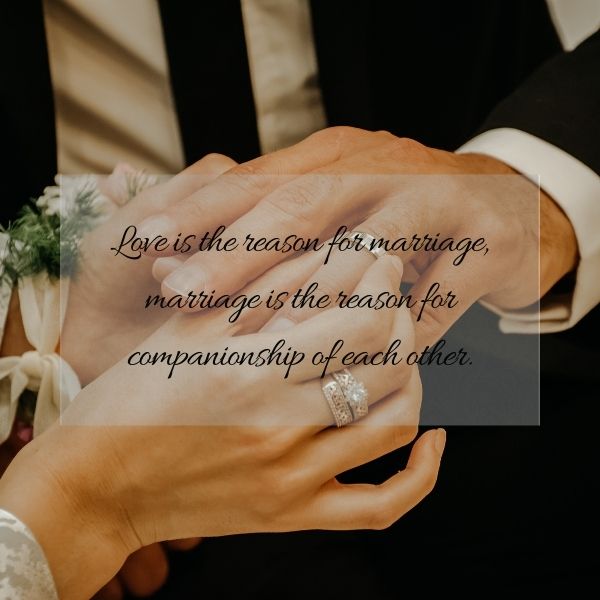 Close-up of a couple's hands during wedding vows with a quote about love and marriage.