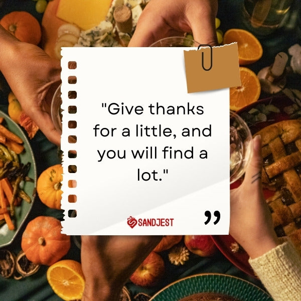Close-up of hands clinking glasses over a Thanksgiving meal with an inspirational thanks giving quotes.