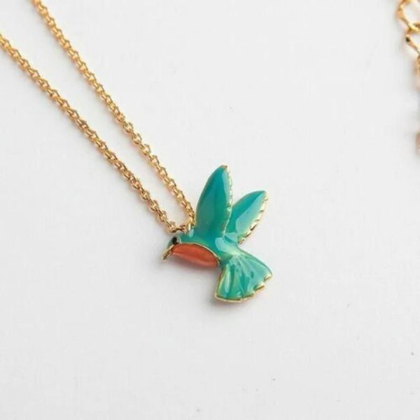 Add a touch of whimsy with the Kate Spade New York Scenic Route Hummingbird Mini Pendant.