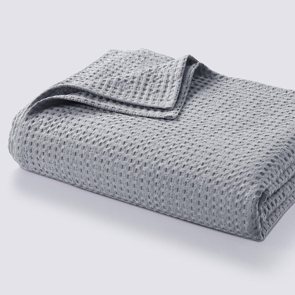 Living Waffle Weave Cotton Throw Blanket features cozy and breathable fabric, perfect for gifts for men under $50.