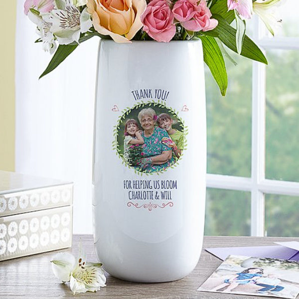 A Love Blooms photo vase adorned with images of loved ones
