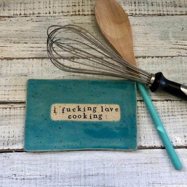 Love Cooking ceramic dish, a humorous addition to Mother's Day gifts.