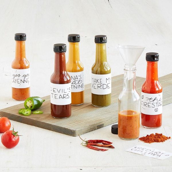 A Make Your Own Hot Sauce Kit is a spicy and creative Christmas gift for couples.