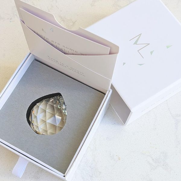 Memorialight crystal ball in a presentation box, a luminous keepsake for pet remembrance.