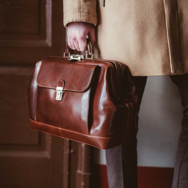 Travel in style with a Men's Large Leather Doctor Bag, a perfect accessory for doctors on the go.
