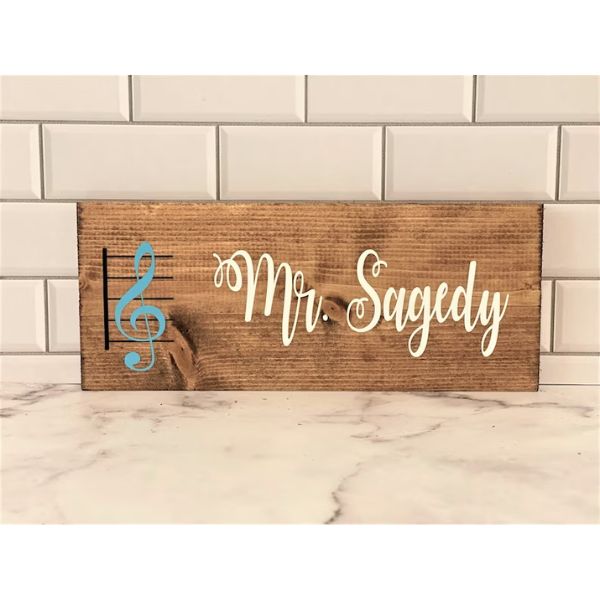 Celebrate a music teacher with the Music Teacher Gift Personalized Teacher Sign Teacher Name Plate, a custom sign that speaks to the heart of education.