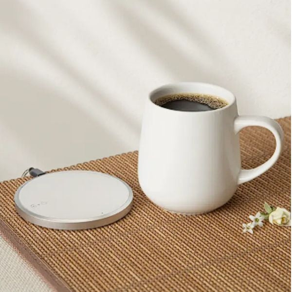 Keep her beverages warm with style using the OHOM Ui Mug & Warmer Set, a chic and practical anniversary gift for your wife.