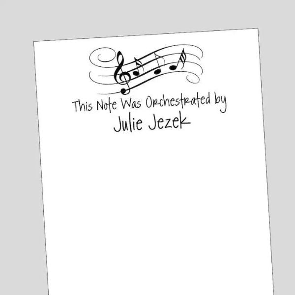 Jot down musical inspirations with the Orchestra Notepad, a handy and stylish notepad for capturing notes and melodies on the go.