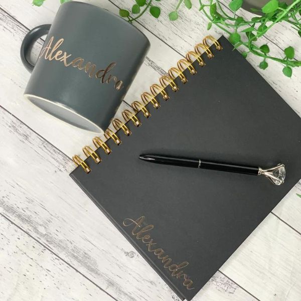Unwrap the joy of learning with our Personalized Black Mug And Notebook Gift Set, a perfect male teacher gift.