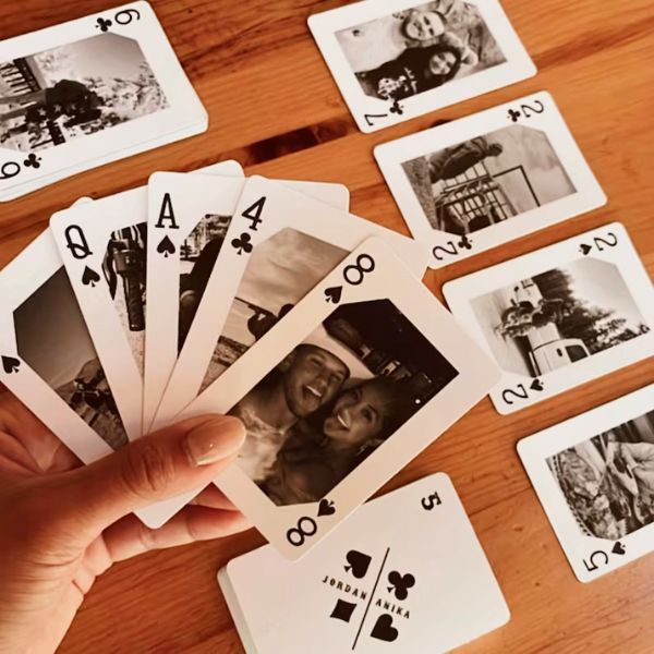 Deck of playing cards personalized with couple's photos for 60th anniversary.