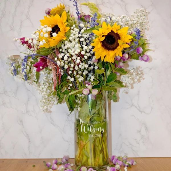 Personalized Engraved Glass Vase holding a vibrant array of sunflowers, marking a blooming three year anniversary gift.