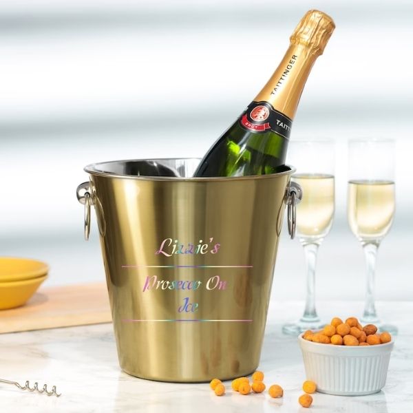 Personalized Ice Bucket with Matching Glasses is a chic and functional 50th anniversary gift for hosting.