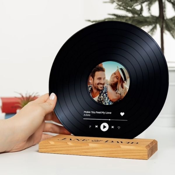 Personalized Vinyl with Wooden Stand strikes a nostalgic chord, an ideal 50th anniversary gift for music lovers.