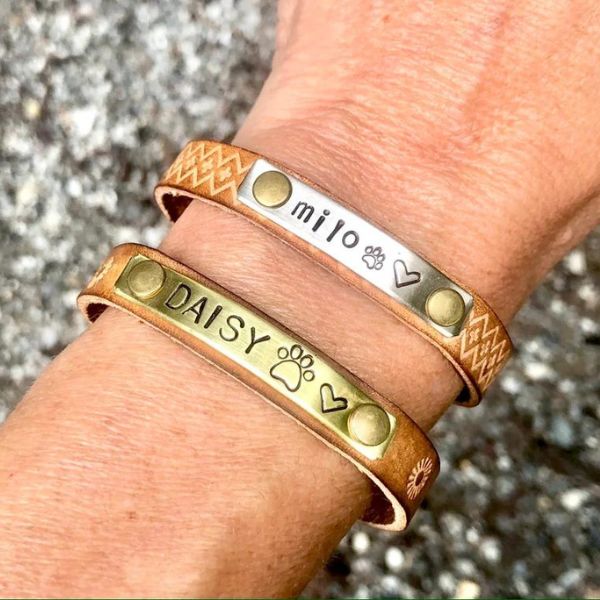 Customized memorial bracelets engraved with pet names, celebrating a lasting bond.