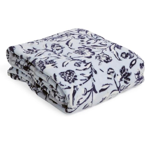 Plush throw blanket, a soft and cozy gift under $50 for her comfort.