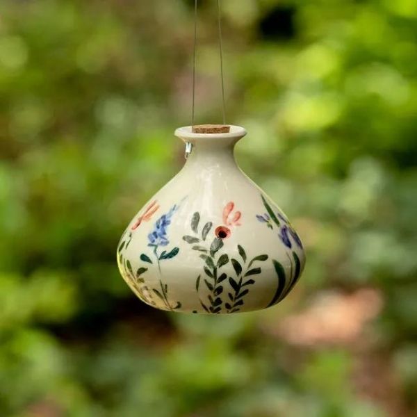 Porcelain Hummingbird Feeder is a delicate and beautiful 50th anniversary gift, inviting nature's wonders home.