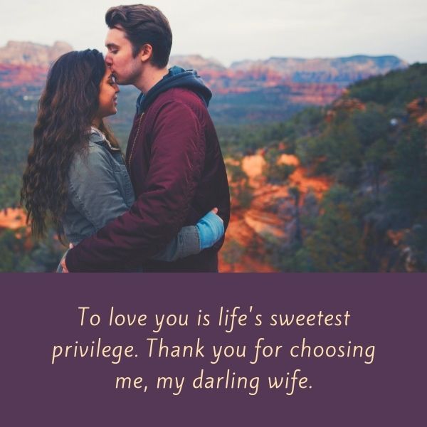 Couple kissing in scenic nature with love quote about life's sweet privilege.