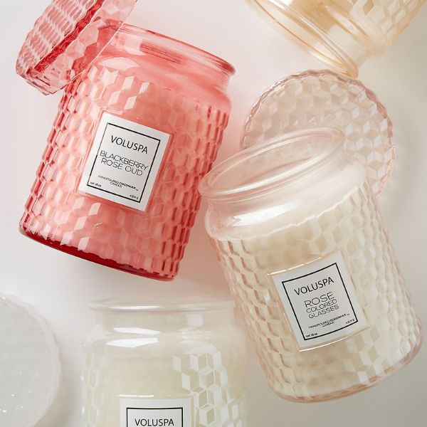 A fragrant Roses Embossed Jar Candle is a thoughtful gift for mom from daughter to create a cozy atmosphere.
