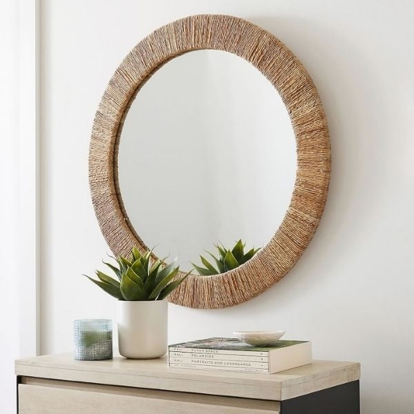 A stunning Round Wall Mirror, a reflective Mother's Day gift from a daughter, adding elegance to mom's living space