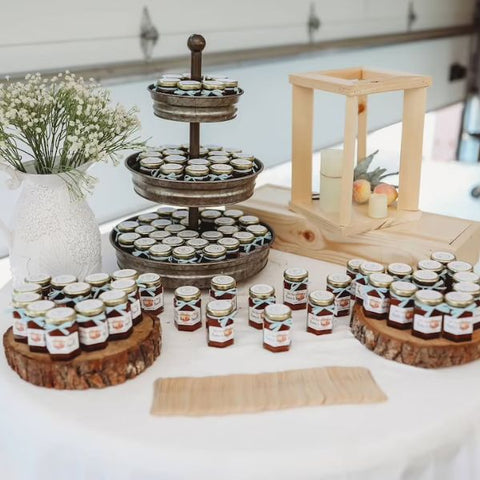 Homemade jam jars, a delightful treat for wedding guests.