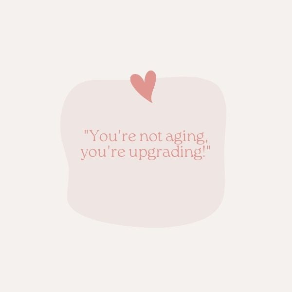 A short and sweet birthday message "You're not aging, you're upgrading!" set on a playful, heart-adorned backdrop.