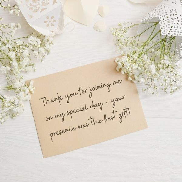 Rustic thank you note with gypsophila flowers, appreciating presence as the best gift on a special day