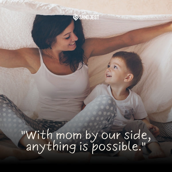 A joyful mother and son play under a blanket fort, epitomizing short inspirational mom quotes.