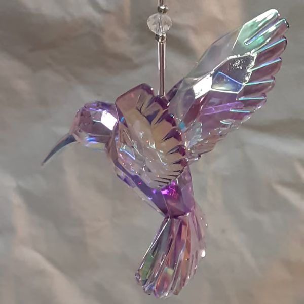 Hang the Silver Themed Acrylic Crystal Hummingbird Sun Catcher for a dazzling display.
