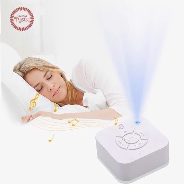 A serene working mom lies comfortably in her bedroom, surrounded by calming soothing sleep machine