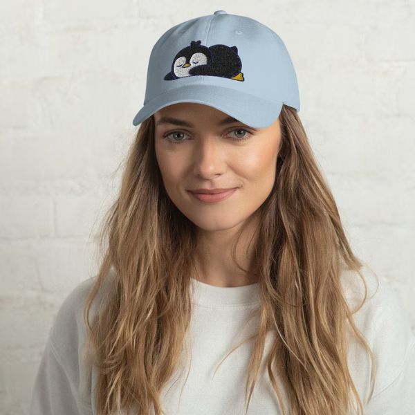 Sleepy Penguin Dad Hat is a fashionable choice for penguin lovers.