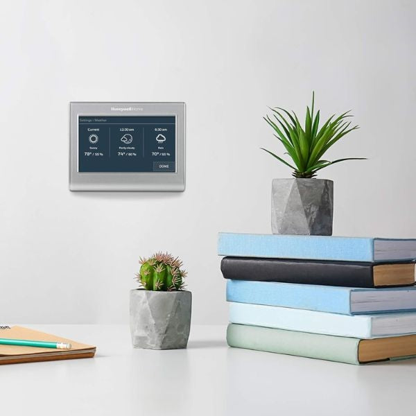 Stay comfortable year-round with a Smart Thermostat, a modern housewarming gift for couples.