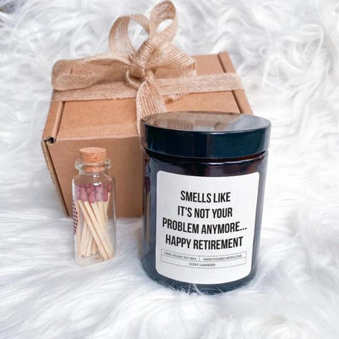 Scented candle with humorous 'Happy Retirement' message for coworkers.