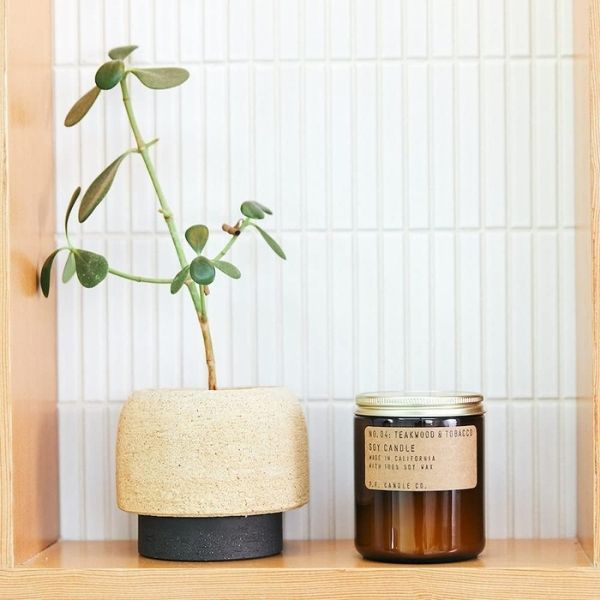 Soy candle, a serene and fragrant gift under $50 for her ambiance.