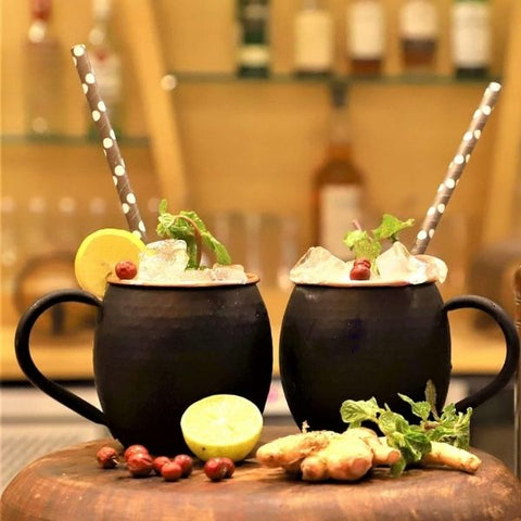 Handcrafted cocktails in unique mugs, a sophisticated 21st birthday idea for the mixology curious.