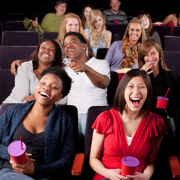 Audience laughing together at a stand-up comedy event.