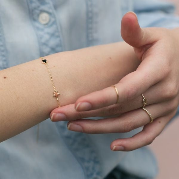 Star Bracelet, a celestial and dainty accessory, adds a touch of sparkle to your daughter-in-law's wrist, symbolizing your stellar connection.