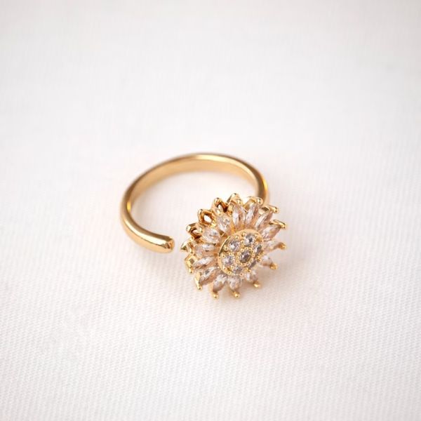 A golden Sunflower Ring with a sparkling center, embodying the warmth of a 3 year anniversary gift.