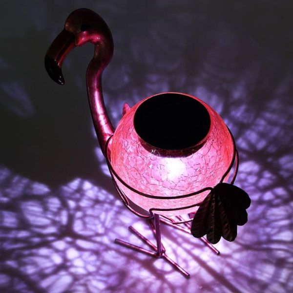 Tabletop Flamingo Lantern sets a cozy mood for indoor and outdoor settings.