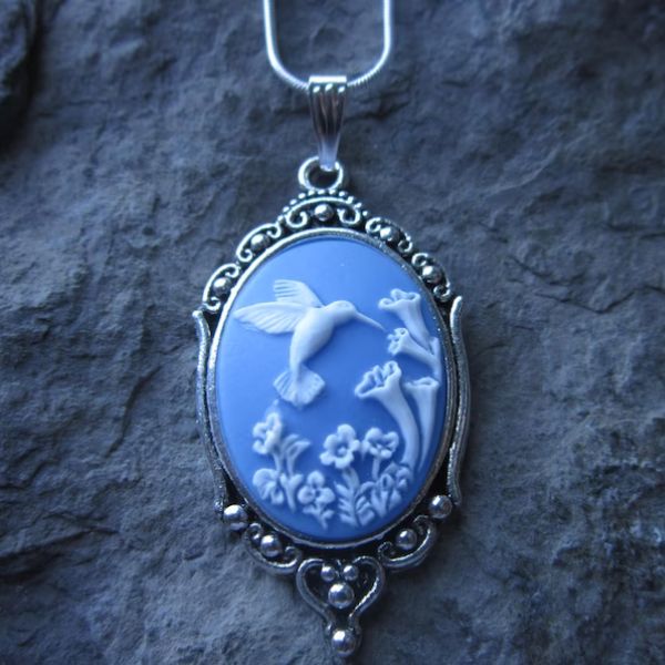 The Hummingbird Cameo Pendant Necklace is a timeless piece of nature-inspired jewelry.