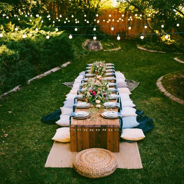 Outdoor dinner party, an elegant 50th birthday idea under the stars with loved ones.