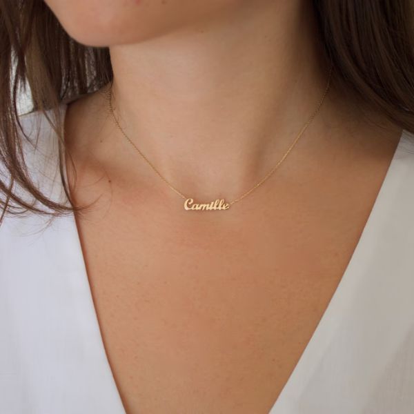 Personalize her style with the Tiniest Name Necklace, a delicate and heartfelt gift for your girlfriend.