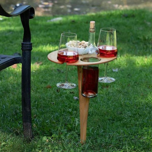 Uncommon Goods Outdoor Wine Table, a portable and stylish solution for wine lovers on the go.