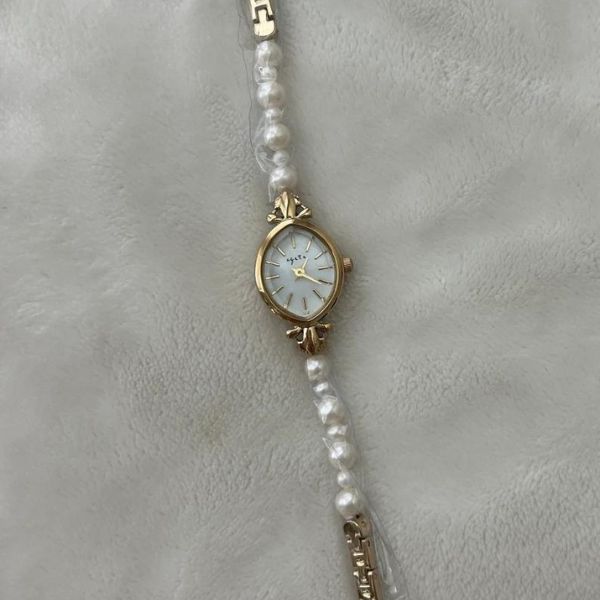 Vintage Gold Pearl Watch reflecting timeless elegance, a sophisticated 3 year anniversary gift for her.