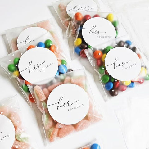 Customized candy bags filled with sweets for guests.