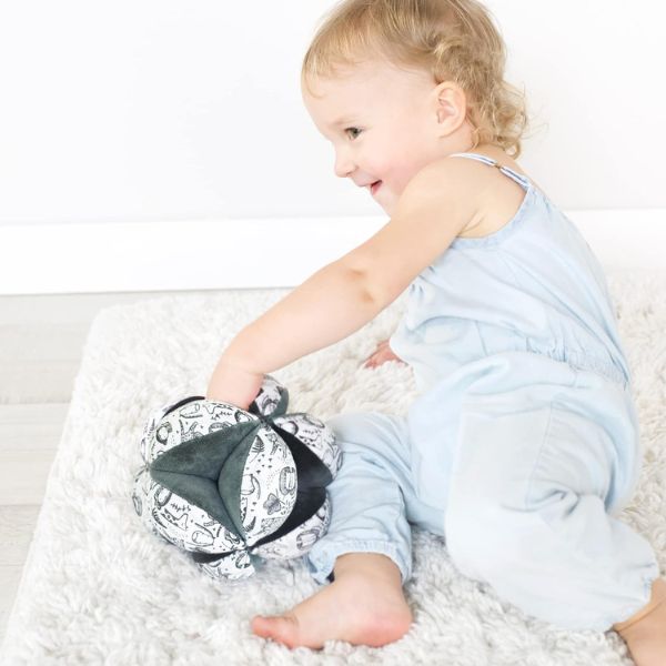 Wee Gallery Sensory Clutch Ball as a tactile delight for Baby Day playtime.