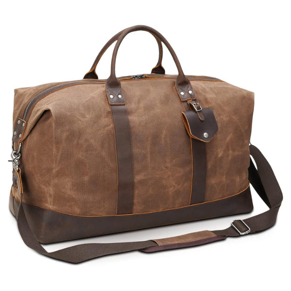 Pack up for a weekend adventure in elegance with our leather-trimmed weekender duffle!