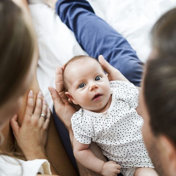 A warm and loving image of a parent looking at their daughter.