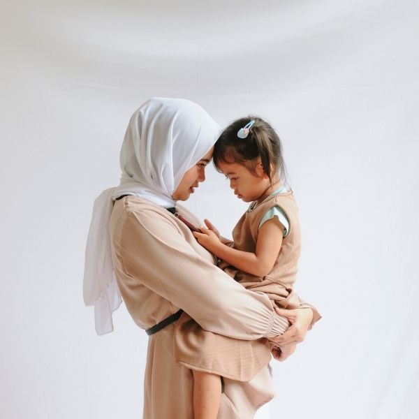 Daughter gazing affectionately at her mother, framed by emotional quotes expressing a daughter's love and admiration.