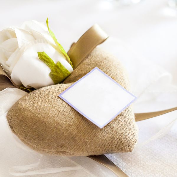 Fabric heart and white rose favor as pet memorial gifts to express sympathy and support.