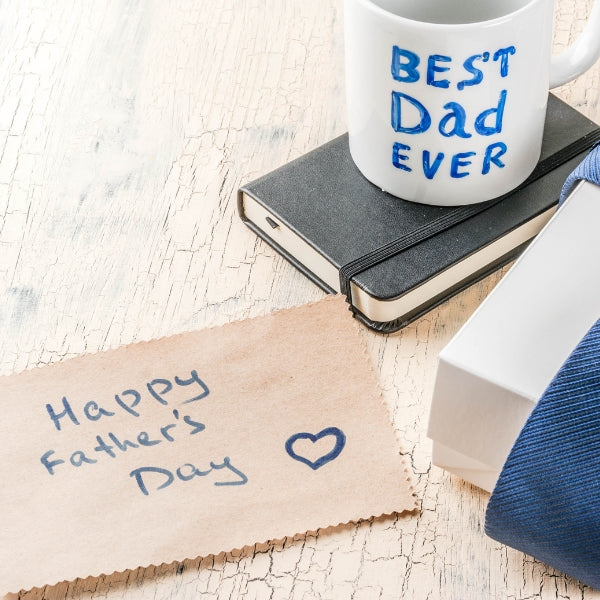 A note expressing love, to the playful declaration of 'BEST Dad EVER' on a coffee mug.